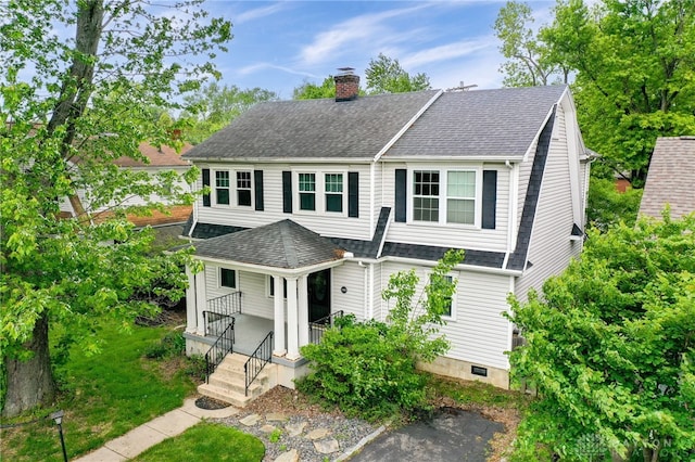 1809 Shroyer Rd, Oakwood, OH 45419 - view of front facade with a chimney, roof with shingles, a porch, and crawl space
