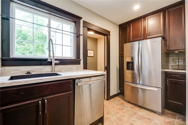 1809 Shroyer Rd, Oakwood, OH 45419 - kitchen featuring stainless steel appliances, dark brown cabinetry, and light stone counters