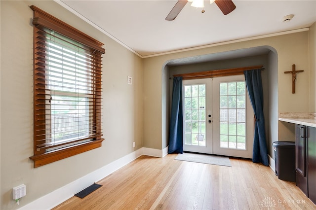 1809 Shroyer Rd, Oakwood, OH 45419 - entryway featuring french doors, light wood-style floors, a ceiling fan, and ornamental molding