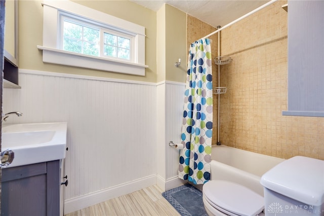 1809 Shroyer Rd, Oakwood, OH 45419 - bathroom with vanity, shower / bath combo with shower curtain, and a wainscoted wall