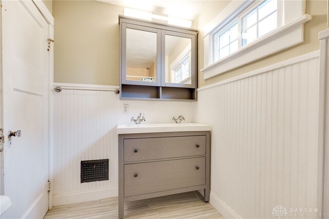1809 Shroyer Rd, Oakwood, OH 45419 - bathroom with vanity, wainscoting, and wood finished floors