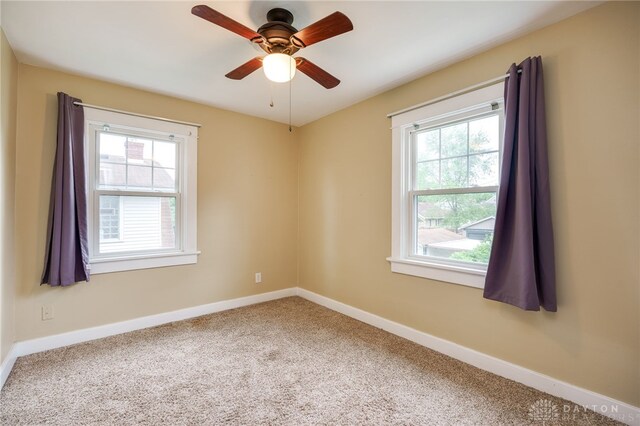 1809 Shroyer Rd, Oakwood, OH 45419 - unfurnished room with plenty of natural light, carpet flooring, and a ceiling fan