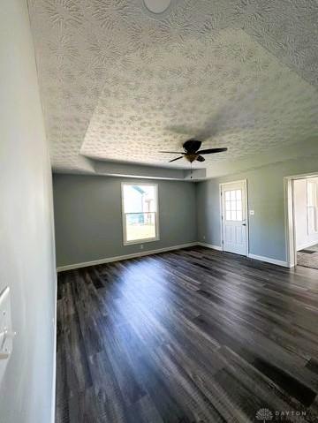 304 W Walnut St, Botkins, OH 45306 - empty room featuring baseboards, plenty of natural light, a ceiling fan, and a textured ceiling