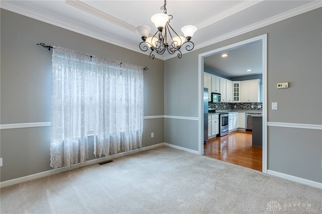 6265 Amberley Ct, Liberty Twp, OH 45044 - unfurnished dining area with carpet, a chandelier, ornamental molding, and baseboards