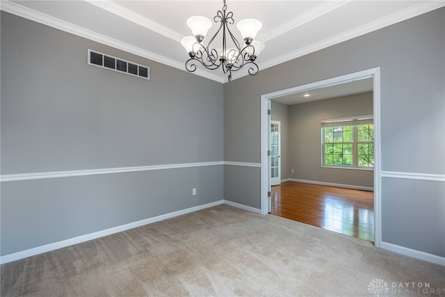 6265 Amberley Ct, Liberty Twp, OH 45044 - carpeted spare room featuring ornamental molding, a chandelier, and baseboards