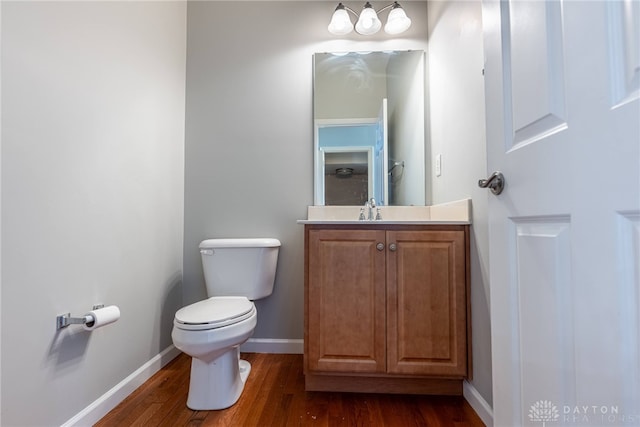 6265 Amberley Ct, Liberty Twp, OH 45044 - bathroom featuring toilet, vanity, wood finished floors, and baseboards