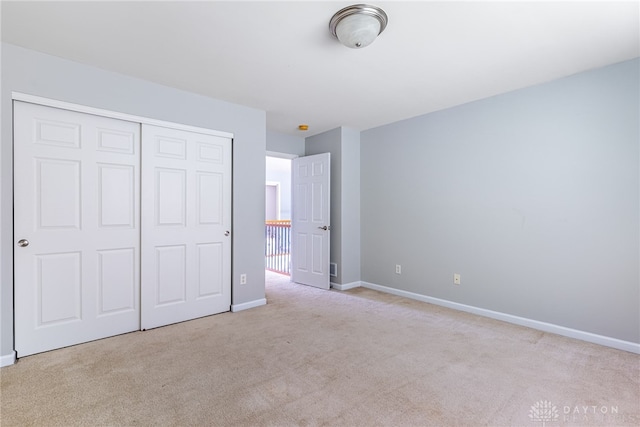 6265 Amberley Ct, Liberty Twp, OH 45044 - unfurnished bedroom featuring carpet floors, a closet, and baseboards