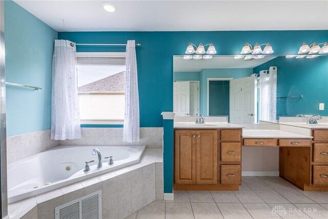 6265 Amberley Ct, Liberty Twp, OH 45044 - bathroom with a jetted tub, vanity, and tile patterned flooring