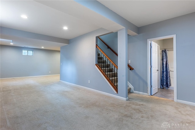 6265 Amberley Ct, Liberty Twp, OH 45044 - below grade area featuring carpet floors, baseboards, stairway, and recessed lighting
