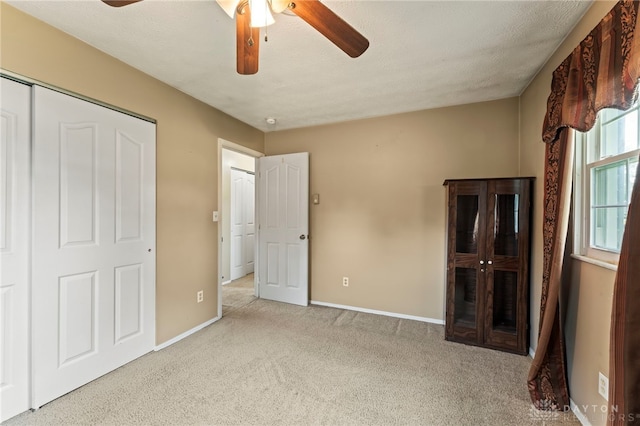 668 Dakota Dr, Xenia, OH 45385 - unfurnished bedroom featuring carpet flooring, baseboards, and ceiling fan