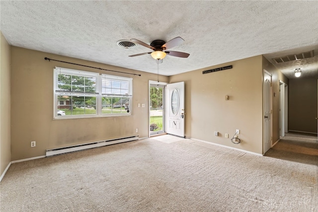 668 Dakota Dr, Xenia, OH 45385 - unfurnished room featuring a baseboard heating unit, ceiling fan, carpet, a textured ceiling, and baseboards