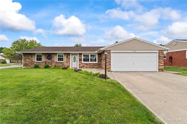 668 Dakota Dr, Xenia, OH 45385 - ranch-style house with concrete driveway, an attached garage, brick siding, and a front yard