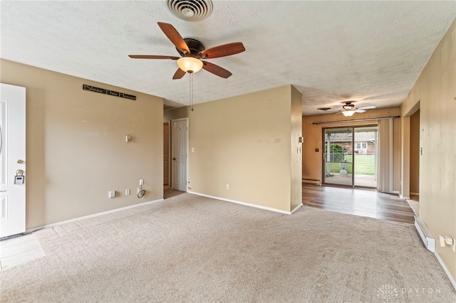 668 Dakota Dr, Xenia, OH 45385 - empty room with a ceiling fan, carpet floors, a textured ceiling, and baseboards