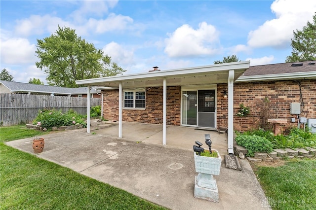 668 Dakota Dr, Xenia, OH 45385 - rear view of property with brick siding and a patio