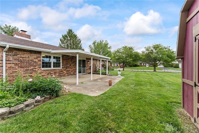 668 Dakota Dr, Xenia, OH 45385 - view of grassy yard with a patio