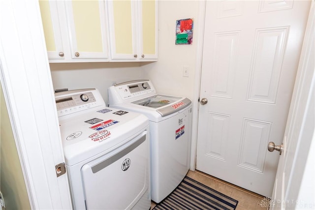 2385 Gerard Ct, Fairborn, OH 45324 - laundry area with independent washer and dryer, cabinet space, and light tile patterned floors