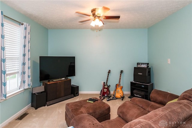 2385 Gerard Ct, Fairborn, OH 45324 - carpeted living area featuring ceiling fan, baseboards, and a textured ceiling