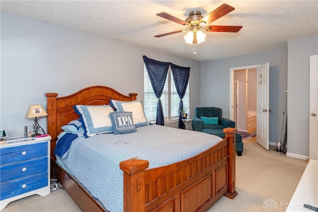2385 Gerard Ct, Fairborn, OH 45324 - bedroom with light carpet, baseboards, a textured ceiling, a ceiling fan, and ensuite bath
