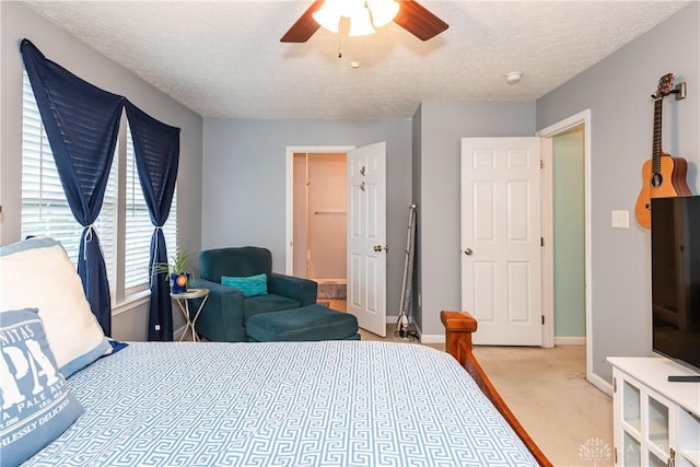 2385 Gerard Ct, Fairborn, OH 45324 - bedroom with light colored carpet, a textured ceiling, baseboards, and ceiling fan