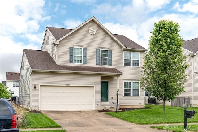 2385 Gerard Ct, Fairborn, OH 45324 - traditional-style home featuring driveway, a garage, cooling unit, and a shingled roof