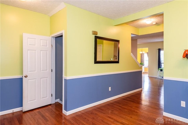 2385 Gerard Ct, Fairborn, OH 45324 - unfurnished room featuring a textured ceiling, wood finished floors, and baseboards