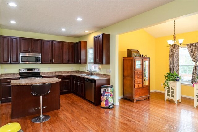 2385 Gerard Ct, Fairborn, OH 45324 - kitchen featuring stainless steel appliances, a sink, light wood finished floors, recessed lighting, and pendant lighting