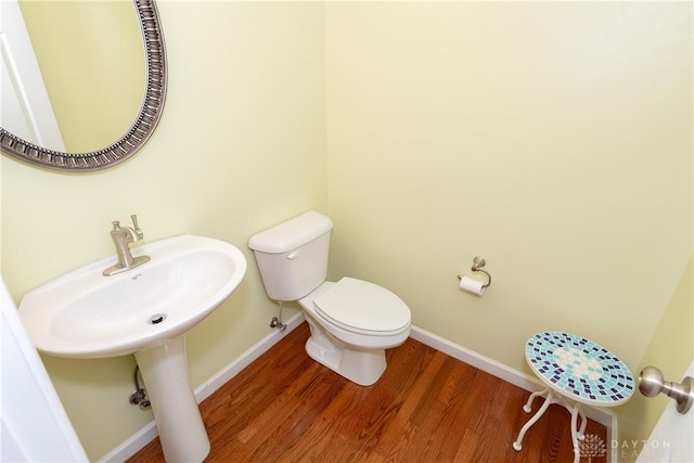 2385 Gerard Ct, Fairborn, OH 45324 - half bath featuring wood finished floors, toilet, and baseboards