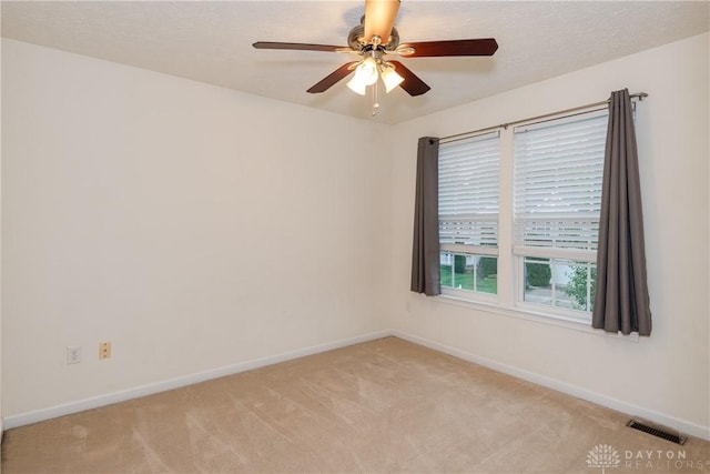 2385 Gerard Ct, Fairborn, OH 45324 - empty room with light colored carpet, ceiling fan, and baseboards