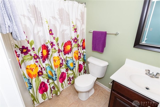 2385 Gerard Ct, Fairborn, OH 45324 - bathroom featuring vanity, toilet, baseboards, a shower with shower curtain, and tile patterned floors