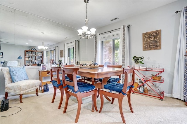 1357 Tattersall Rd Unit 70, Dayton, OH 45459 - dining area featuring a chandelier and light carpet