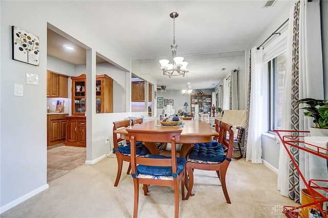 1357 Tattersall Rd Unit 70, Dayton, OH 45459 - dining space with light carpet, a chandelier, and baseboards