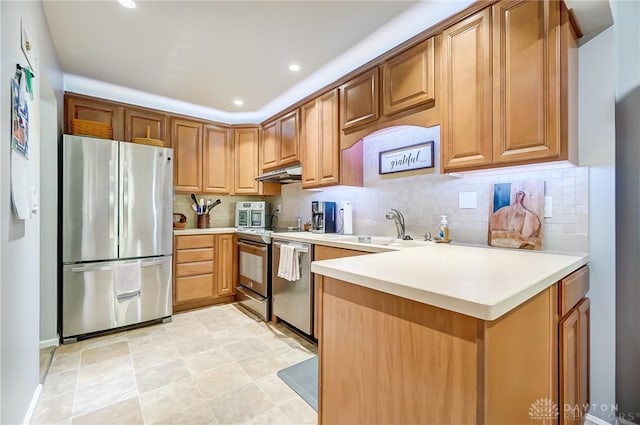 1357 Tattersall Rd Unit 70, Dayton, OH 45459 - kitchen featuring appliances with stainless steel finishes, a sink, under cabinet range hood, decorative backsplash, and recessed lighting