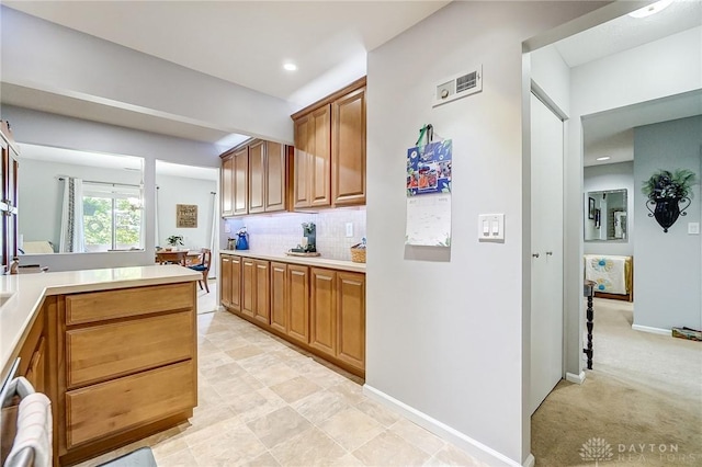 1357 Tattersall Rd Unit 70, Dayton, OH 45459 - kitchen with light countertops, backsplash, stainless steel dishwasher, brown cabinets, and recessed lighting