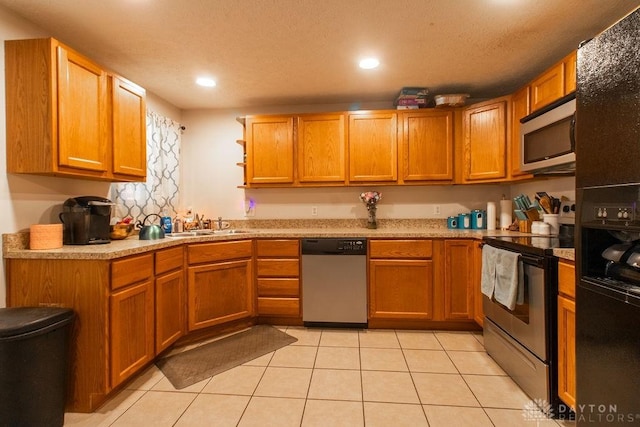 5864 Beecham Dr, Huber Heights, OH 45324 - kitchen with appliances with stainless steel finishes, a sink, light tile patterned floors, open shelves, and light countertops