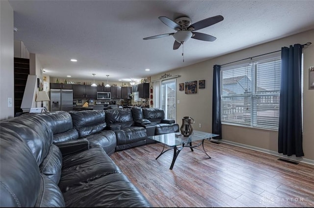 426 Sudbury Dr, Trenton, OH 45067 - living room with a ceiling fan, light wood-style flooring, baseboards, and recessed lighting