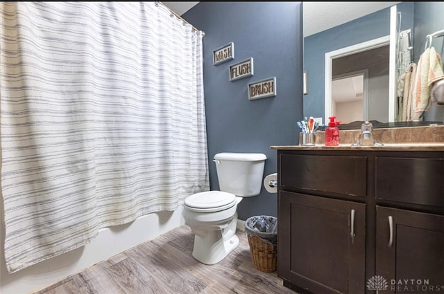 426 Sudbury Dr, Trenton, OH 45067 - bathroom with toilet, vanity, wood finished floors, shower / bath combo, and baseboards