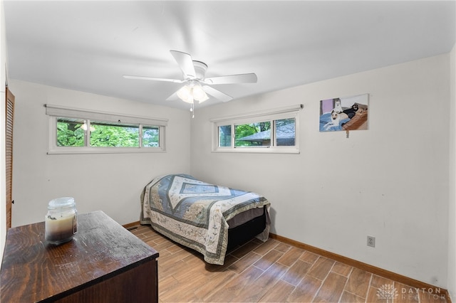 3646 Utica Dr, Dayton, OH 45439 - bedroom with baseboards, wood finished floors, and ceiling fan