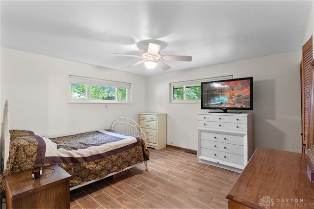 3646 Utica Dr, Dayton, OH 45439 - bedroom featuring baseboards, wood finished floors, and ceiling fan