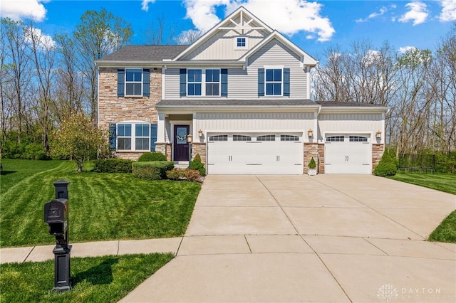 4069 Fawn Crossing Dr, Mason, OH 45040 - craftsman-style house with stone siding, driveway, a front lawn, a garage, and board and batten siding