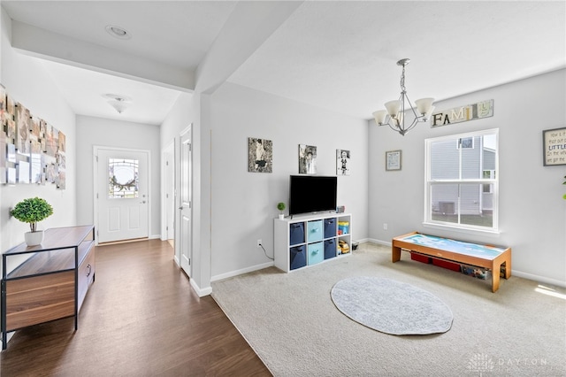 4069 Fawn Crossing Dr, Mason, OH 45040 - playroom featuring a chandelier, dark wood finished floors, and baseboards