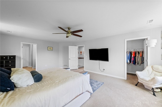 4069 Fawn Crossing Dr, Mason, OH 45040 - carpeted bedroom with a walk in closet, baseboards, ceiling fan, and a closet
