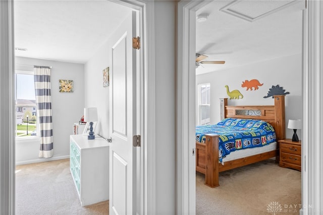 4069 Fawn Crossing Dr, Mason, OH 45040 - bedroom with light colored carpet, baseboards, ceiling fan, and attic access