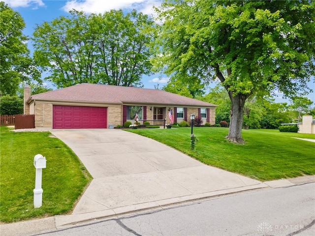 6719 Morrow Dr, Clayton, OH 45415 - ranch-style house with an attached garage, concrete driveway, and brick siding