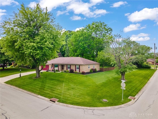 6719 Morrow Dr, Clayton, OH 45415 - ranch-style house with a front yard, driveway, and a garage