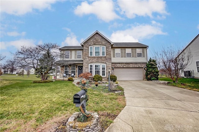 1061 Dapple Ct, Fairborn, OH 45324 - traditional home featuring a garage, covered porch, concrete driveway, a front yard, and stone siding
