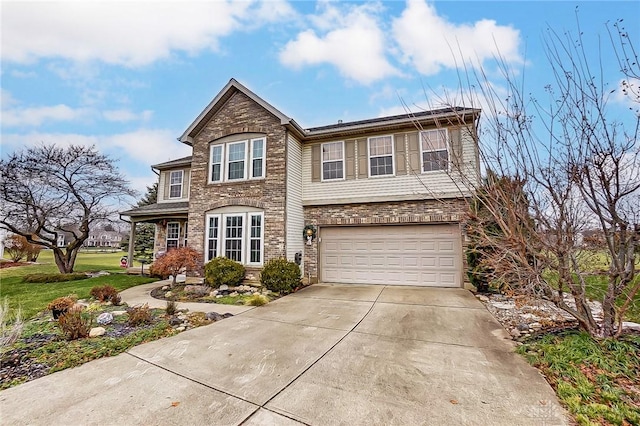 1061 Dapple Ct, Fairborn, OH 45324 - traditional-style house with stone siding, an attached garage, driveway, and a front yard