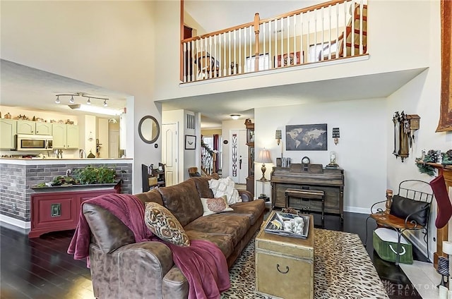 1061 Dapple Ct, Fairborn, OH 45324 - living area with dark wood-type flooring, a high ceiling, and baseboards