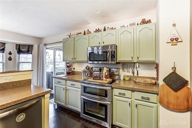 1061 Dapple Ct, Fairborn, OH 45324 - kitchen featuring stainless steel appliances, green cabinetry, and dark wood-style flooring