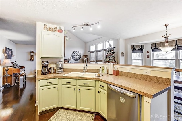 1061 Dapple Ct, Fairborn, OH 45324 - kitchen featuring dishwasher, a sink, a peninsula, dark wood-type flooring, and green cabinetry