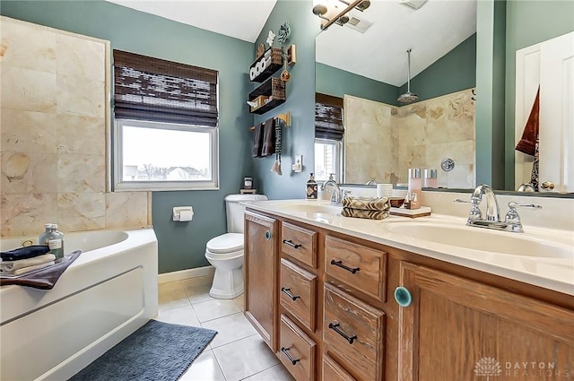 1061 Dapple Ct, Fairborn, OH 45324 - full bath with a garden tub, lofted ceiling, double vanity, tile patterned floors, and toilet